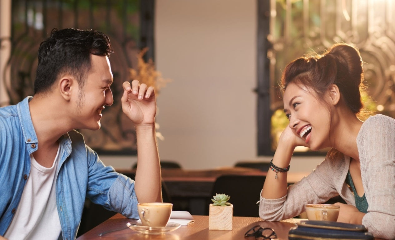 Two people meeting over coffee at a café